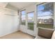 Cozy outdoor patio space with a cushioned sofa and bright natural light at 952 Virginia St # 108, Dunedin, FL 34698