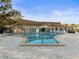 Community pool with a deck and chairs, perfect for enjoying the outdoors at 952 Virginia St # 108, Dunedin, FL 34698