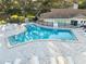 Beautiful community pool with a spacious deck and lounge chairs, great for relaxation at 952 Virginia St # 108, Dunedin, FL 34698