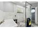 Elegant bathroom features a tub, glass-enclosed shower, and designer tile for a spa-like experience at 9606 Braden Run, Bradenton, FL 34202