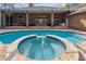 Luxury pool and spa with brick exterior, outdoor seating and beautifully landscaped yard at 9606 Braden Run, Bradenton, FL 34202
