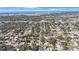 Expansive aerial view of a charming neighborhood near the water, showcasing the beautiful landscape and proximity to the city at 10373 54Th N Ave, St Petersburg, FL 33708