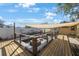 Outdoor patio with a covered area, built-in seating, fire pit, and wooden fence at 10373 54Th N Ave, St Petersburg, FL 33708