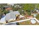 Aerial view of backyard with a deck featuring a shade sail, perfect for outdoor relaxation and entertaining at 10373 54Th N Ave, St Petersburg, FL 33708