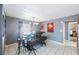 Dining room with modern industrial style table and bench with unique lighting fixture at 10373 54Th N Ave, St Petersburg, FL 33708