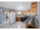 Well-equipped kitchen with ample cabinet space, black appliances, and modern backsplash at 10373 54Th N Ave, St Petersburg, FL 33708