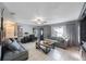 Cozy living room featuring tile flooring, neutral paint, comfortable seating, and ample natural light at 10373 54Th N Ave, St Petersburg, FL 33708