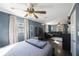 Open living space featuring a ceiling fan, hardwood floors, and a comfortable gray sectional sofa at 10373 54Th N Ave, St Petersburg, FL 33708