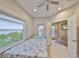 Bright bedroom with natural light, tile flooring, and a view of the outdoors at 11008 Sand Pine Ln, Parrish, FL 34219