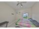 Comfortable bedroom with a workspace, tile flooring and natural light at 11008 Sand Pine Ln, Parrish, FL 34219