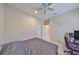 Simple bedroom featuring a ceiling fan, and closet door offering simple comfort and convenience at 11008 Sand Pine Ln, Parrish, FL 34219