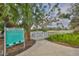 Gated dog park featuring lush landscaping and signage displaying dog park rules for the community to enjoy at 11008 Sand Pine Ln, Parrish, FL 34219