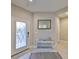 Inviting foyer with tile flooring, a decorative mirror, and a stylish console table at 11008 Sand Pine Ln, Parrish, FL 34219