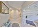 Neutral hallway with tile flooring and an open doorway to another room at 11008 Sand Pine Ln, Parrish, FL 34219