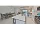 Spacious kitchen island in an open layout flows into a living area and a lovely patio at 11008 Sand Pine Ln, Parrish, FL 34219