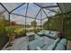 Stylish lanai featuring a conversation area with pond views at 11008 Sand Pine Ln, Parrish, FL 34219