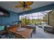 Beautiful, screened lanai with dining and seating areas that overlooks a tranquil pond at 11008 Sand Pine Ln, Parrish, FL 34219