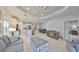 Open-concept living space with a seamless flow between the living room, kitchen, and dining area at 11008 Sand Pine Ln, Parrish, FL 34219