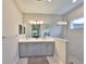 Well-lit main bathroom with dual sinks, neutral walls, and a glass-enclosed walk-in shower at 11008 Sand Pine Ln, Parrish, FL 34219