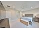This is a large main bedroom with ensuite bathroom, stylish furniture, and neutral walls at 11008 Sand Pine Ln, Parrish, FL 34219