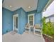 Inviting front porch with seating area, perfect for enjoying the outdoors at 11008 Sand Pine Ln, Parrish, FL 34219
