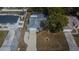 Aerial view of property, showing backyard pool, fenced-in yard, and surrounding neighborhood at 11283 Portsmouth St, Spring Hill, FL 34609