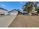 Lovely single-story home with a two-car garage and well-maintained lawn and landscaping at 11283 Portsmouth St, Spring Hill, FL 34609