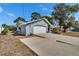Charming single-story home with a attached garage and a well-manicured lawn, offering curb appeal and comfort at 11283 Portsmouth St, Spring Hill, FL 34609