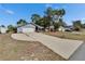 Charming single-story home featuring a large driveway and an attached two-car garage at 11283 Portsmouth St, Spring Hill, FL 34609