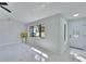 Bright living room with white marble floors, modern window, and an elegant front door at 11283 Portsmouth St, Spring Hill, FL 34609