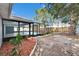 Screened pool with landscaped garden and spacious backyard, perfect for outdoor entertaining and relaxation at 11283 Portsmouth St, Spring Hill, FL 34609