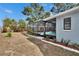 Backyard showcasing a screened pool and patio deck, perfect for relaxation and outdoor entertainment at 11283 Portsmouth St, Spring Hill, FL 34609