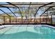The screened pool enclosure is the perfect place to spend your afternoons at 11283 Portsmouth St, Spring Hill, FL 34609