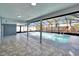 Enclosed pool with tiled patio and screened enclosure to keep you bug-free at 11283 Portsmouth St, Spring Hill, FL 34609