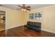 Bedroom with hardwood floors, window with blinds, and ceiling fan with light at 11351 130Th Ave, Largo, FL 33778