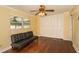 Bedroom features hardwood floors, closet with folding doors, and ceiling fan with light at 11351 130Th Ave, Largo, FL 33778