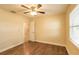 This is a bedroom with hardwood floors and a ceiling fan. A closet is visible in the background at 11351 130Th Ave, Largo, FL 33778