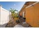 Side yard of the house featuring a small garden area and exterior details at 11351 130Th Ave, Largo, FL 33778