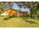 Charming single Gathering home on a sunny day with mature trees and a large yard at 11351 130Th Ave, Largo, FL 33778