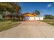 Charming single-story home with a two-car garage, driveway, and well-maintained front yard at 11351 130Th Ave, Largo, FL 33778