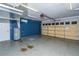 Spacious garage featuring a painted floor, water heater, and garage door with windows at 11351 130Th Ave, Largo, FL 33778