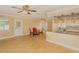 Bright open-plan kitchen and dining area with a stainless steel dishwasher at 11351 130Th Ave, Largo, FL 33778
