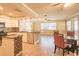 Open kitchen and dining area featuring tile flooring and stainless steel appliances at 11351 130Th Ave, Largo, FL 33778