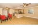 Bright kitchen and dining area with a central island and tile flooring at 11351 130Th Ave, Largo, FL 33778