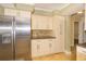 Bright kitchen with stainless steel refrigerator and a decorative backsplash at 11351 130Th Ave, Largo, FL 33778