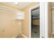 A laundry room with white shelves and access to the garage, ready for chores at 11351 130Th Ave, Largo, FL 33778