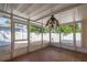 Relaxing enclosed patio offers screened windows, ceiling fan, and access to the backyard at 11351 130Th Ave, Largo, FL 33778
