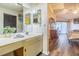 Bright bathroom featuring a large vanity, dual mirrors, and plenty of counter space at 11743 Rolling Pine Ln, Port Richey, FL 34668
