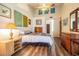 Bright bedroom with a ceiling fan, wood-look flooring, and plenty of natural light at 11743 Rolling Pine Ln, Port Richey, FL 34668