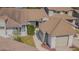 Neutral exterior showcasing a well-maintained home with a brown roof and attached garage at 11743 Rolling Pine Ln, Port Richey, FL 34668